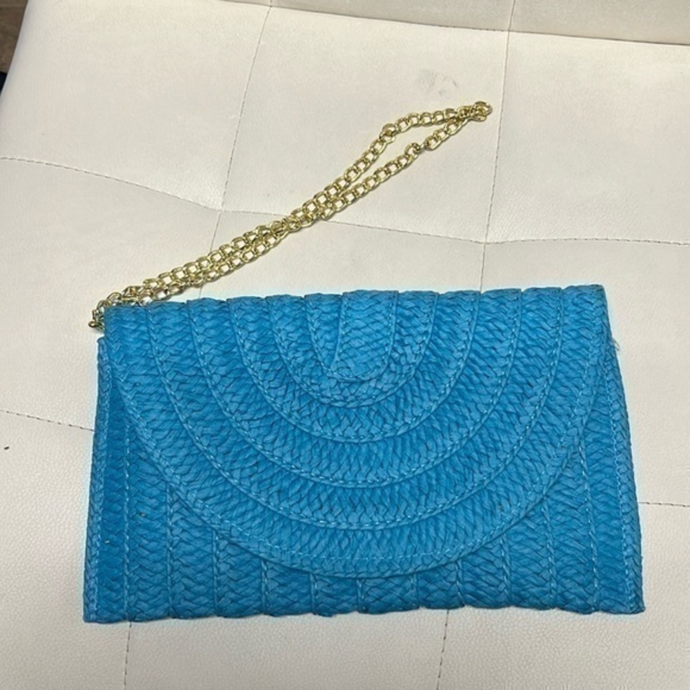 sol and mer blue woolen Clutch in handwoven crochet raffia